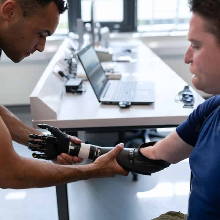 Man having a prosthetic arm fitted